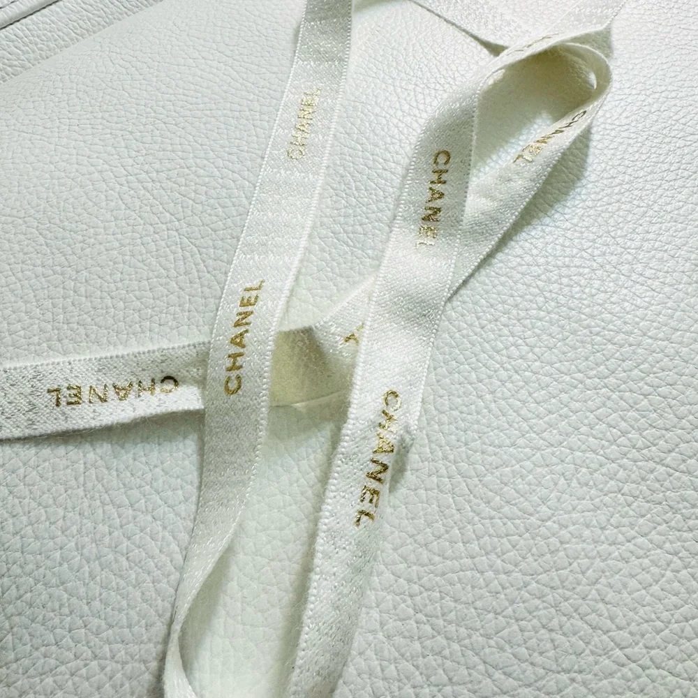 Chanel White Ribbon w gold font limited edition for holiday